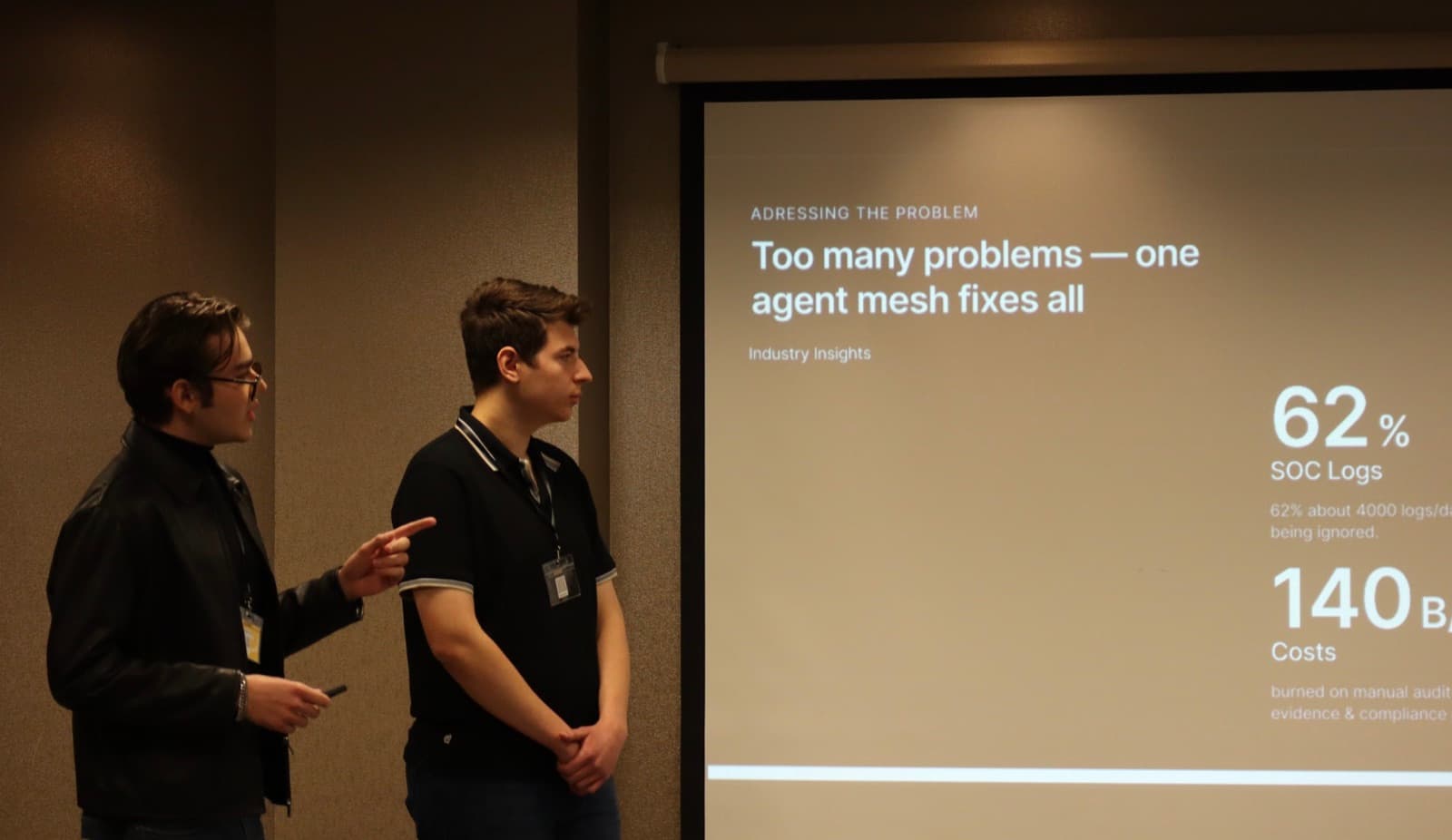 Two founders presenting their pitch deck to the room