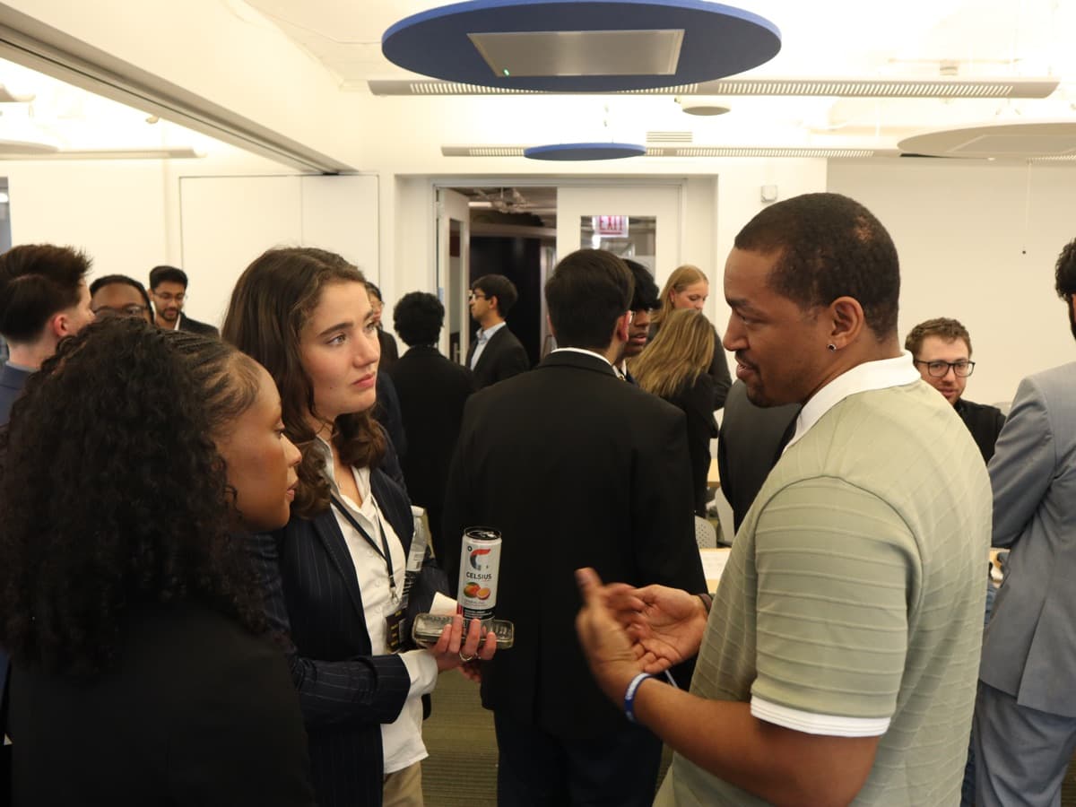 Attendees talking between rounds